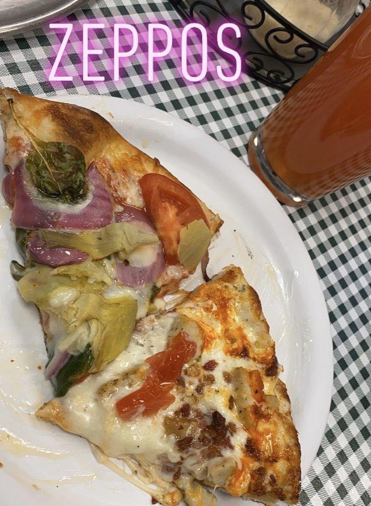 Edgy Vegi Specialty Pizza · Red Sauce, Garlic oil, Mozzarella, spinach, Red Onions, artichoke hearts, and Tomatoes.