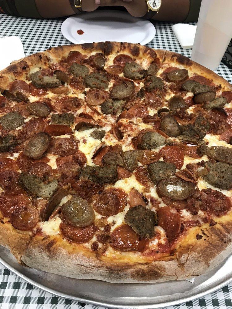 Giovanni Special Pizza · Red Sauce, Mozzarella, Canadian bacon, Pepperoni, Meatballs, Sausage, and Bacon.