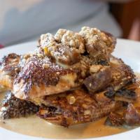 Banana Walnut French Toast · Our signature French toast with baked plantain, walnuts and caramelized buttercream sauce.