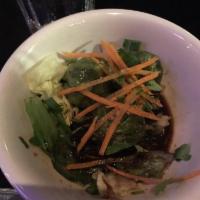 Vegetable Dumpling · Spinach, carrot and snow pea with black bean vinaigrette. 