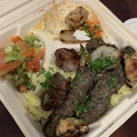 Mixed Kabab Plate · 3 skewers, basmati rice, house salad, hummus dip, pita bread, tahini sauce, and garlic sauce.