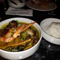 Kreyol Seafood Curry · Poached Alaskan King Crab, Head on Shrimp, Steamed Mussels, Seared Scallops, Roasted Seasona...