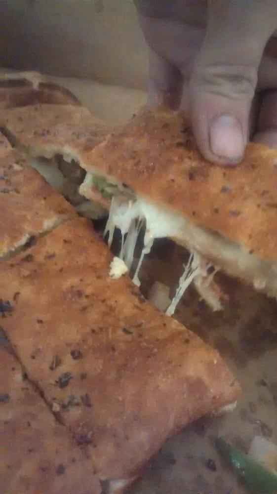 Chicken Ranch Calzone · Tomatoes, chicken, onions, ranch, green peppers, ricotta, and Romano.