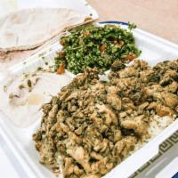 Chicken Shawerma · Seasoned chicken wrapped in pita bread, pickles, Mediterranean salad, hummus and tahini sauce.