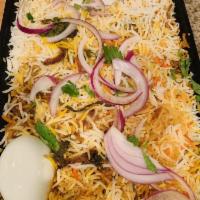 Hyderabadi Chicken Dum Biryani · Seasoned mixed rice.