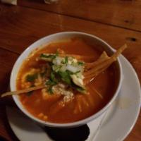 Tortilla Soup · A tomato broth based soup with your choice of chicken or vegetables, topped with tortilla st...