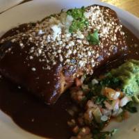 Chile Relleno Burrito · Cotijo, pico de gallo and fresh guacamole. Made with black beans, Mexican rice, whole wheat ...