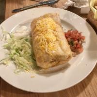 Chimichanga · A crisp deep fried flour tortilla stuffed with choice of meat or vegetables, finished with M...