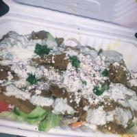Gyro Salad · Salad with thin slices of roasted meat.