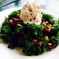Our Original Kale Salad · Chopped fresh kale tossed with miso dressing, dried cranberries, and blueberries, toasted pi...