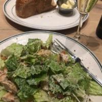 Chicken Caesar Salad · Romaine and our signature Caesar dressing. Available gluten-free.