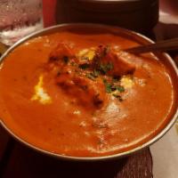Chicken Tikka Masala · Charcoal flavored boneless chicken cooked in Mumbai style cashew butter cream sauce with fre...