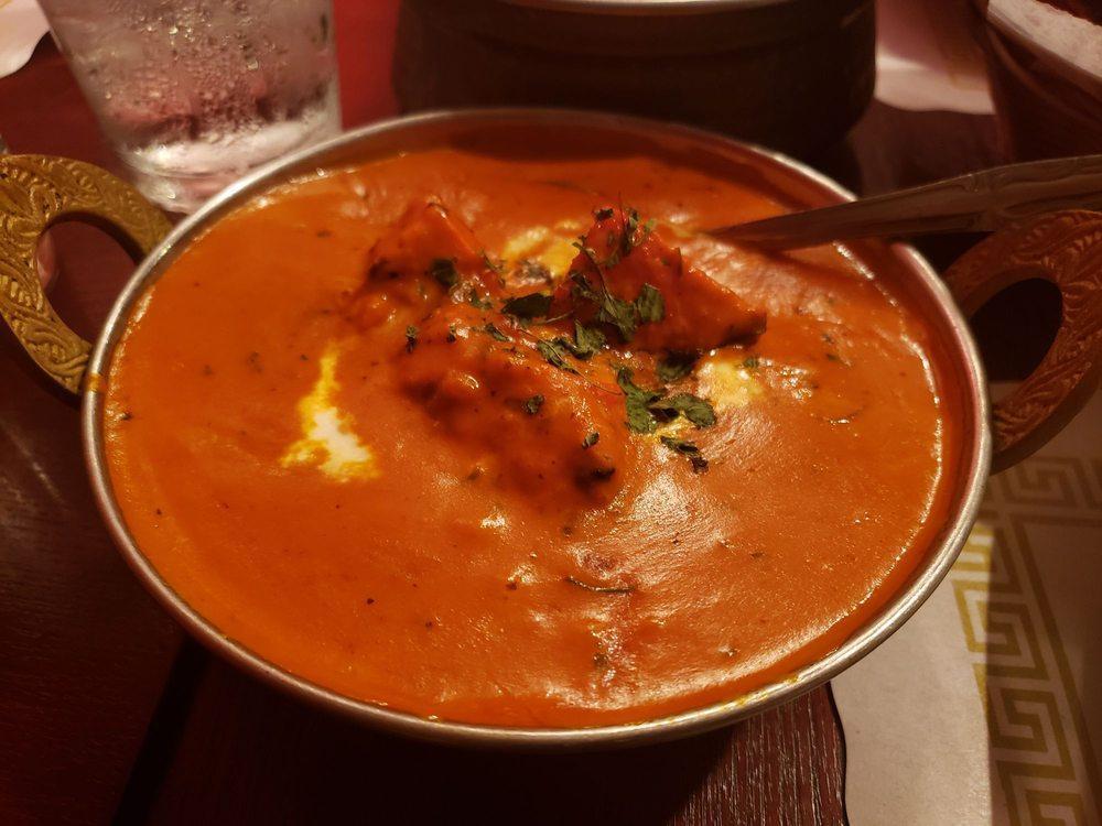 Chicken Tikka Masala · Charcoal flavored boneless chicken cooked in Mumbai style cashew butter cream sauce with fresh tomatoes, ginger and onions.
