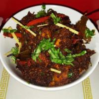 Old Monk Chicken · Chicken roasted in dark rum sauteed in whole Indian spices.