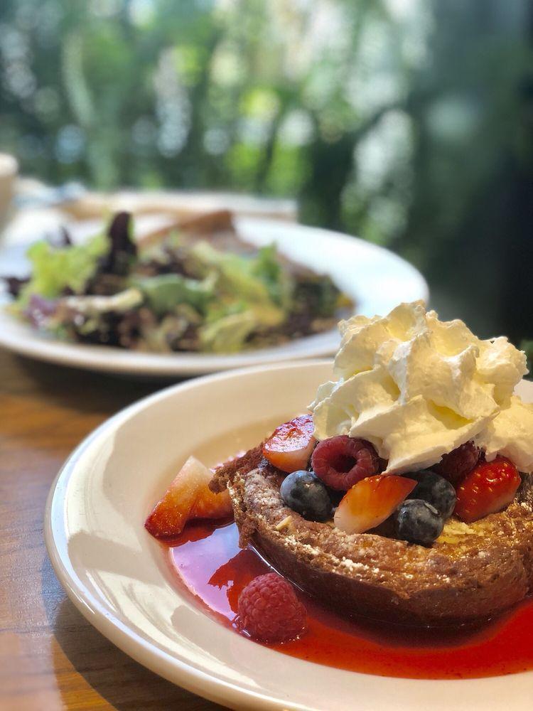 French Toast · Almond brioche, berry sauce, fresh berries and cream.