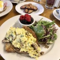 Wild Mushrooms Scrambled Eggs · Wild mushrooms and herbs scrambled eggs over whole wheat toast and side of mixed berries.