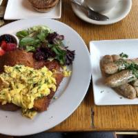 Chive Scrambled Eggs · Chives scrambled eggs, over a toasted brioche and side of mixed berries.