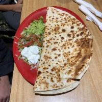 Quesadilla · Choice of meat and served with guacamole, pico de gallo and sour cream on the side served wi...