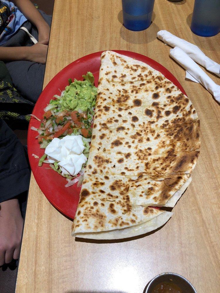 Quesadilla · Choice of meat and served with guacamole, pico de gallo and sour cream on the side served with chips.