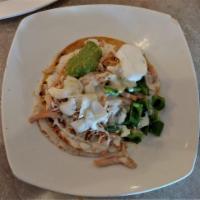 Mexican Pizza · 2 Flour tortillas filled with cheese, beans and topped with your choice of chicken or beef a...