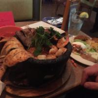 Molcajete · Hot stone bowl filled with rib-eye steak, chicken breast, shrimp, chorizo Mexican sausage, b...