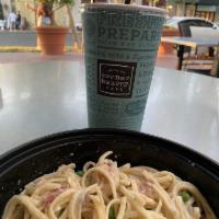 Chicken Carbonara · Grilled chicken, bacon, peas, linguine, and carbonara.