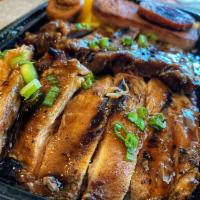 Bento Box · Teriyaki chicken, teriyaki beef, spam, Portuguese sausage, egg, and rice with furikake. Cont...