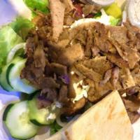 Greek Salad · Mixed greens, tomato, onion, cucumber, pepperoncini, Kalamata olives and feta cheese. Served...