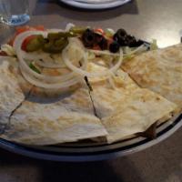 Quesadillas · Cheese, beef, or chicken.