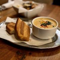 Lobster Bisque · Chilled soup of fresh cooked North Atlantic lobster in the classic combination of tomatoes, ...