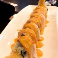 Cowboy Roll · Spicy tuna, avocado, and shrimp tempura on the inside, spicy crabmeat, eel and miso sauce on...