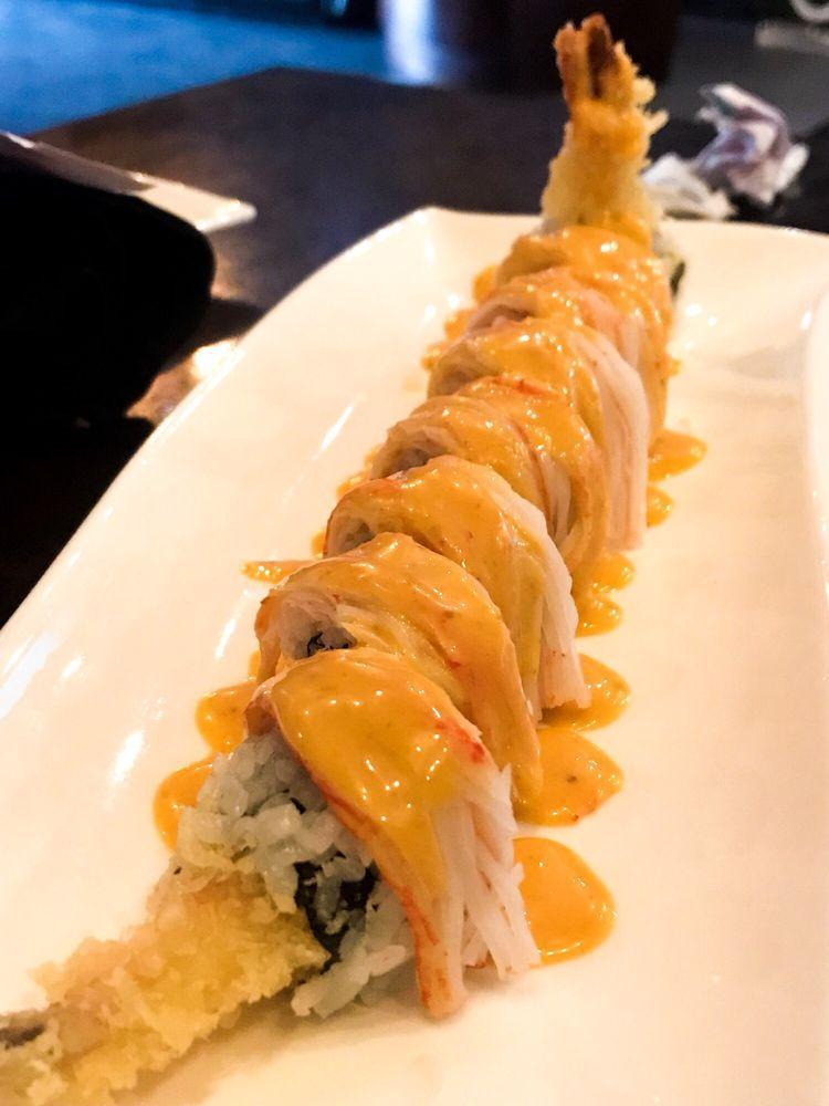 Cowboy Roll · Spicy tuna, avocado, and shrimp tempura on the inside, spicy crabmeat, eel and miso sauce on the outside.