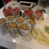 Red Devil Roll · Spicy tuna crunch and avocado on the inside, pepper tuna with Sriracha and coconut wasabi on...