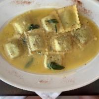 Ravioli · Homemade spinach and ricotta cheese ravioli in a butter and sage sauce.