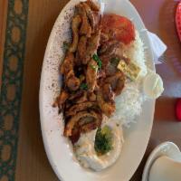 Chicken Shawarma Plate · A generous serving of thinly sliced chicken breast marinated with shawarma spices. Served wi...