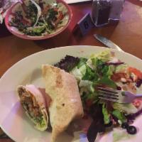 Falafel Wrap · Fried vegetable patties (chickpeas and fava beans) wrapped in pita bread with lettuce, tomat...