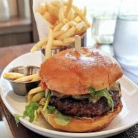 The Frenchie Burger · 8 oz. beef patty, raclette cheese, tomato-onion compote, Pommes Frites, confit pork belly up...