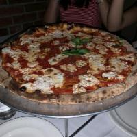 Margherita Pizza · Tomato, mozzarella and basil.
