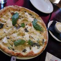 Artichoke Pizza · Spinach, artichoke, mozzarella and Parmigiano.