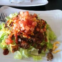 Cheeseburger Salad · Grass fed beef burger, reduced fat cheddar, tomatoes, scallion
with a blend of fat free BBQ...