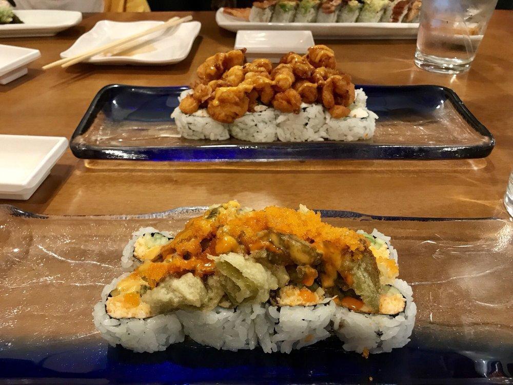 New Mexico Roll · 8 pieces. Green chili tempura, spicy crab, cucumber topped with green chili tempura, fish roe, green onion, and spicy sauce. Spicy.