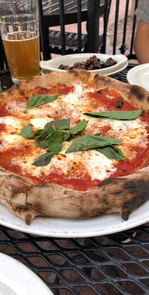 Margherita Pizza · Served with tomato sauce, fresh mozzarella, and basil.