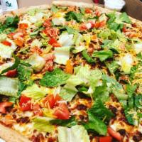 Super Taco Pizza · Salsa, ground beef, onions, tomatoes, gourmet cheese, lettuce, sour cream and cheddar cheese.