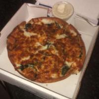 Alfredo Spinach Pizza · Alfredo sauce, garlic, onions, spinach, gourmet cheese and Parmesan cheese.