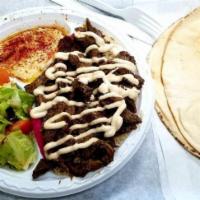Beef Shawarma Wrap · Thin slices of beef marinated and seasoned with a special blend of spices, topped with tahin...