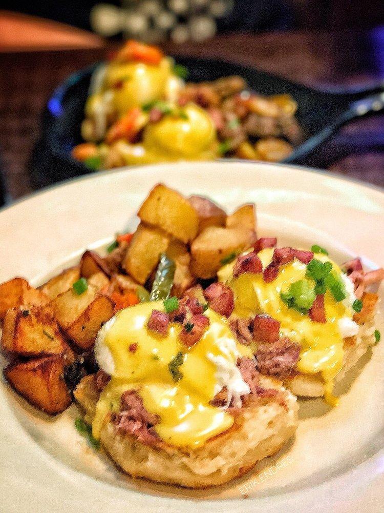 Eggs Benedict · 2 poached eggs, Nueske's shaved ham, Hollandaise on top of a toasted English muffin and served with home fries.