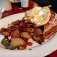 French Toast Monte Cristo · House specialty. Nueske's shaved ham, American cheese, Nueske's bacon and home fries.