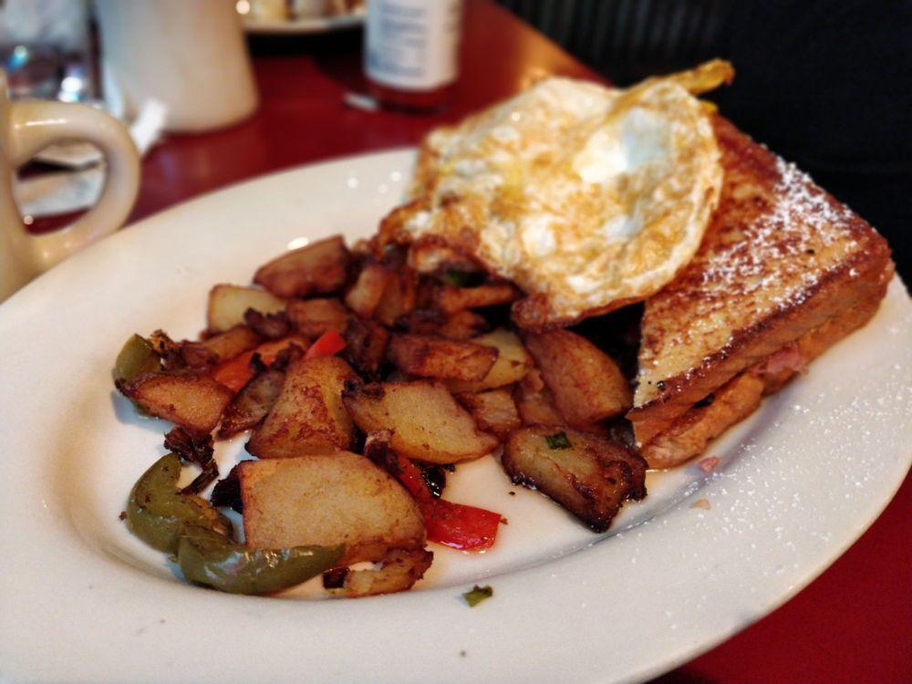 French Toast Monte Cristo · House specialty. Nueske's shaved ham, American cheese, Nueske's bacon and home fries.