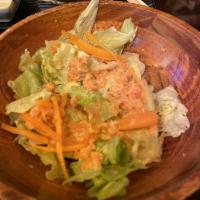 House Ginger Salad · Fresh iceberg lettuce, shredded carrots with our made from scratch and house ginger dressing.