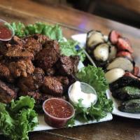 Filet Mignon Plate · 2 barbecued skewers of marinated filet mignon pieces with hummus, tabouli and fresh pita, pi...
